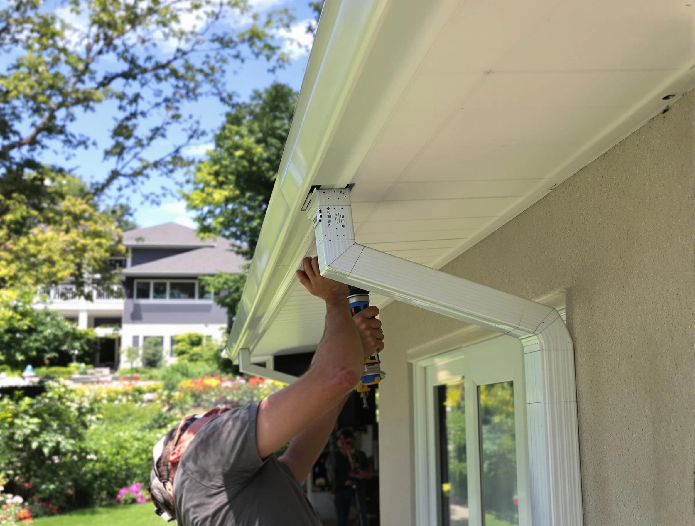 Lorain Roofing Company technicians performing gutter installation in Lorain, OH